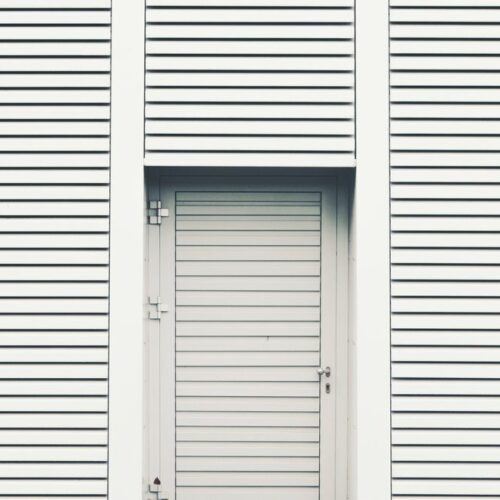 white door on a white building